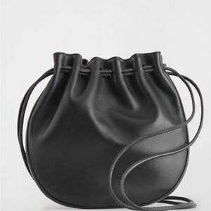 cos Black leather drawstring pouch Crossbody bag handbag purse NWT